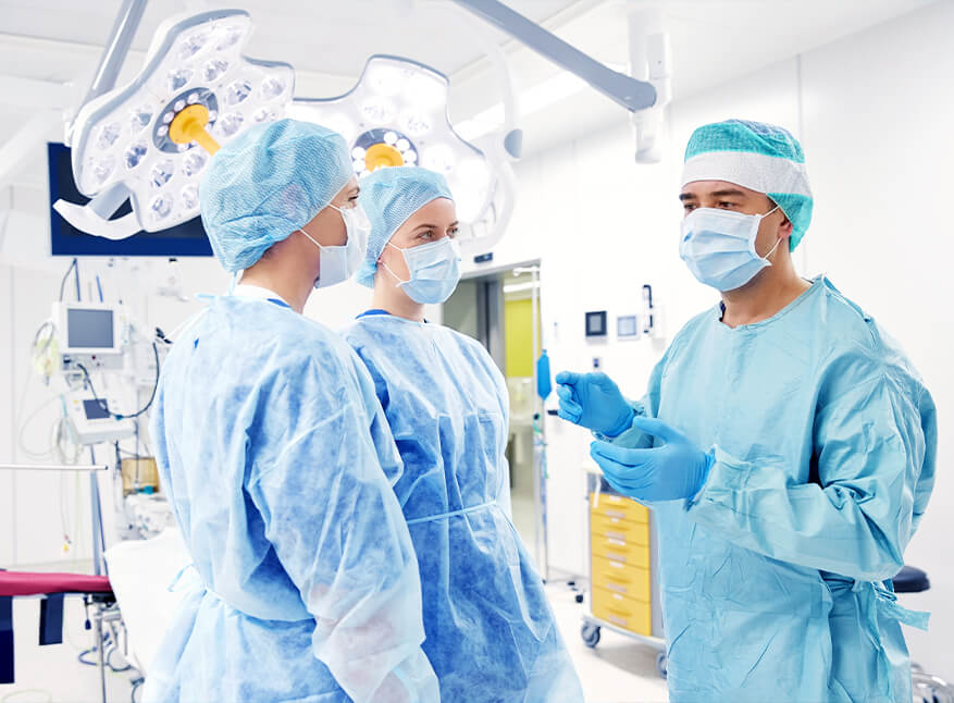 group of surgeons in operating room at hospital PRV58QR